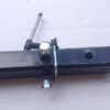 A black trailer hitch with two different types of hardware.